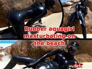 Xozt – Rubber aquagirl masturbating on the beach